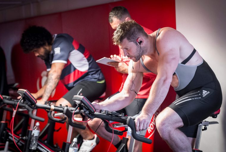 men in a spin class