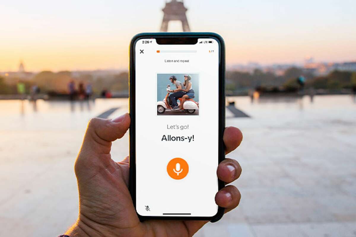 an online language learning app on a phone in paris