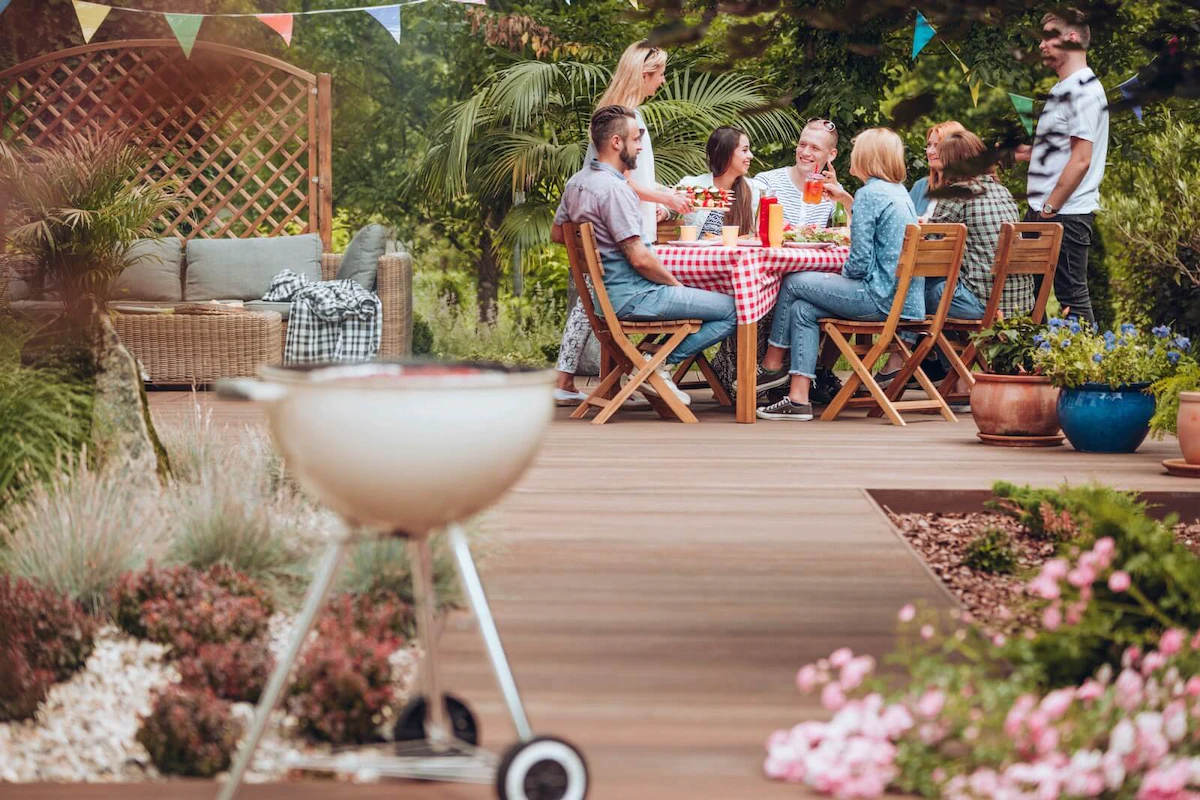 a group of adults celebrating on their patio in the summer