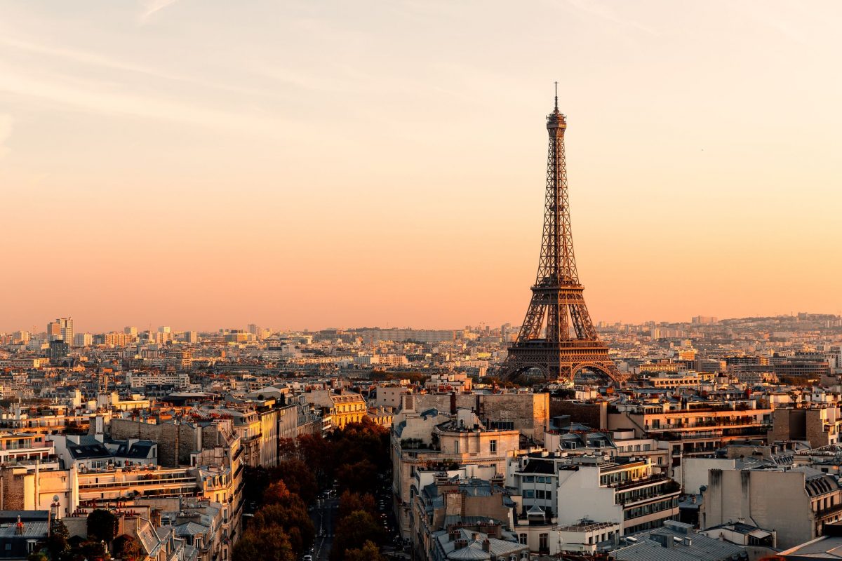 a skyline view of paris as the sun is setting