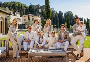the cucinelli family portrait in front of their estate