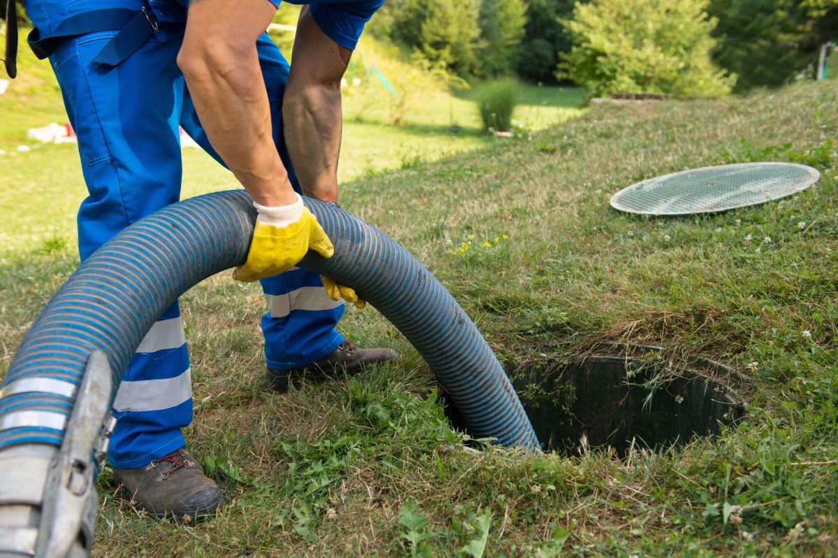 a person doing work on a sewer line