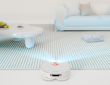 a robot vacuum sensing furniture in a living room